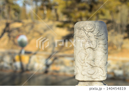 Carved stone post in a peaceful park Carved stone post in a peaceful park 140454819