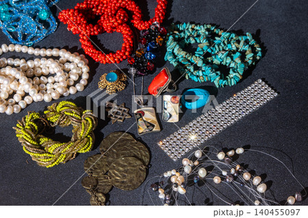 Vintage bohemian jewelry, featuring turquoise beads, pearl necklaces, coral pieces, silver rings necklace background Vintage bohemian jewelry, featuring turquoise beads, pearl necklaces, coral pieces, silver rings necklace background 140455097