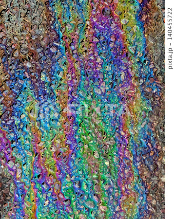 A leaked Car Oil Petrol in The Rain on a Tarmac Road Metallic Rainbow A leaked Car Oil Petrol in The Rain on a Tarmac Road Metallic Rainbow 140455722