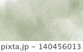 渋いグリーンの水彩絵の具が淡く画用紙に滲む背景イラスト 140456013