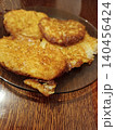 Golden brown potato pancakes, also known as draniki or latkes, prepared as a homemade comfort food dish, served warm on a plate for breakfast or a hearty meal 140456424
