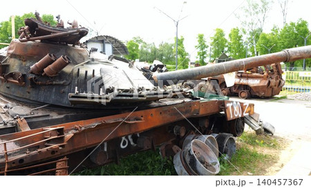 Rusty and burned-out armored vehicles on ukrainian territory. Exhibition of destroyed military equipment of the russian army. War between Ukraine and russia. Close up Slow motion Rusty and burned-out armored vehicles on ukrainian territory. Exhibition of destroyed military equipment of the russian army. War between Ukraine and russia. Close up Slow motion 140457367