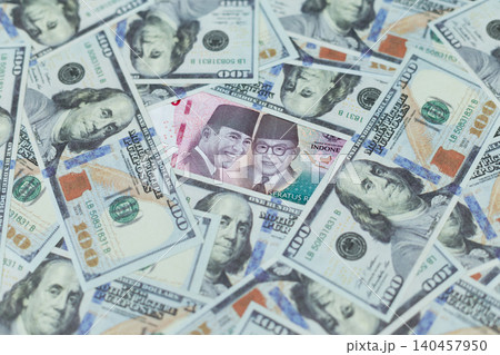 Money piles spread across a flat surface. Mix of dollar and local currency notes. Familiar faces printed on bills, calm expressions. Visual represents wealth, finance, or economic growth. Money piles spread across a flat surface. Mix of dollar and local currency notes. Familiar faces printed on bills, calm expressions. Visual represents wealth, finance, or economic growth. 140457950