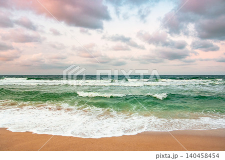 storm on the sandy beach in the afternoon. dramatic sea view with cloudy sky. salt water and crashing waves. view of bulgaria beach in summer. wind weather background storm on the sandy beach in the afternoon. dramatic sea view with cloudy sky. salt water and crashing waves. view of bulgaria beach in summer. wind weather background 140458454