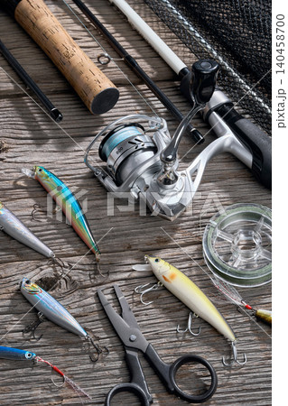 Fishing background angler wobbler and poppers spinning bait concept on wooden background 140458700