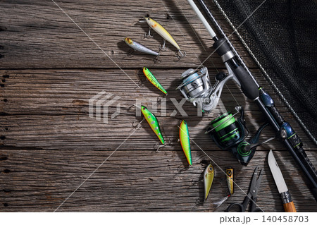 Fishing background angler wobbler and poppers spinning bait concept on wooden background Fishing background angler wobbler and poppers spinning bait concept on wooden background 140458703