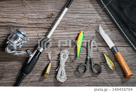 Fishing background angler wobbler and poppers spinning bait concept on wooden background 140458704