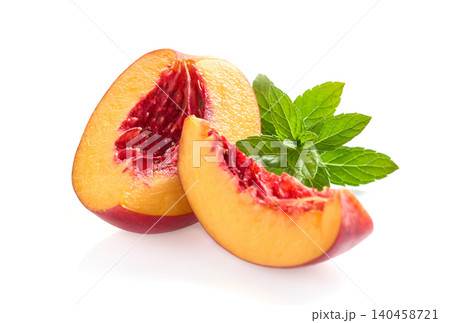 Nectarine with mint leaves in closeup Nectarine with mint leaves in closeup 140458721