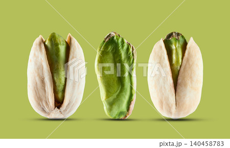 Pistachio nuts in closeup on pistachio background 140458783