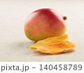 Mango slices dehydrated with mango fruit in closeup 140458789