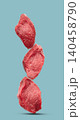 Raw filet mignon on blue background 140458790