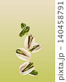 Flying pistachio nuts in closeup on pistachio background 140458791