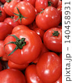 Fresh bright red tomatoes with green stems, abundant and ripe, displaying natural organic beauty, perfect for healthy eating, cooking, and supermarket displays 140458931