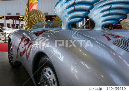Vintage silver racing car with red numbers and blue wings in exhibition hall Vintage silver racing car with red numbers and blue wings in exhibition hall 140459410