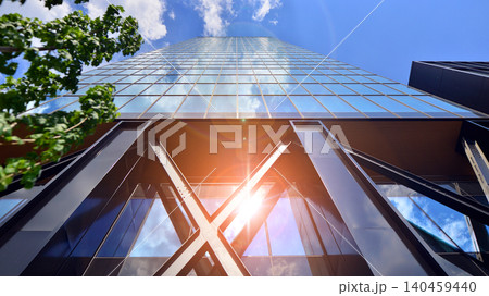 Eco building in modern city concept. Modern office building with the fresh green leaves. Steel and glass. The subject of modern architecture or construction industry. Eco building in modern city concept. Modern office building with the fresh green leaves. Steel and glass. The subject of modern architecture or construction industry. 140459440