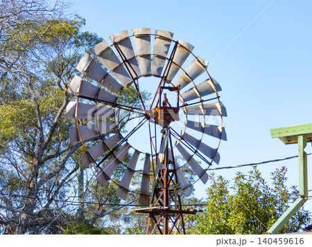 The top section of an old weathered and deteriorated windmill The top section of an old weathered and deteriorated windmill 140459616