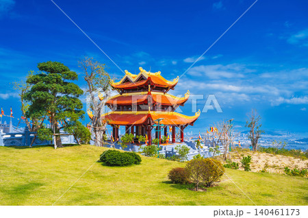gate at the Vietnamese Buddhist Golden Pagoda Truc Lam Phung Thuy Son on mountain in Nha Trang city in Vietnam. Beautiful panoramic view gate at the Vietnamese Buddhist Golden Pagoda Truc Lam Phung Thuy Son on mountain in Nha Trang city in Vietnam. Beautiful panoramic view 140461173