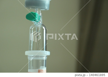saline solution drip for patient and infusion pump in hospital, close up equipment of medicine 140461895