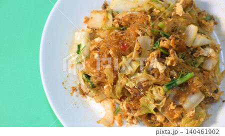 stir fried sukiyaki with egg and pork on white plate 140461902