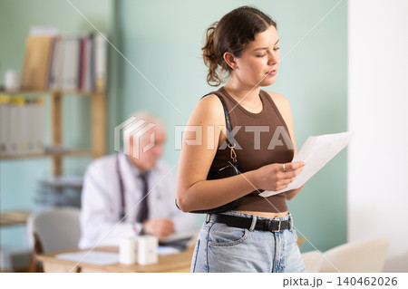 Girl patient leaves doctors office with medical counsel or guidance. Girl patient leaves doctors office with medical counsel or guidance. 140462026