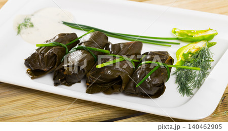 Tasty grape rolls made from grape leaves, dish of Bulgarian cuisine Tasty grape rolls made from grape leaves, dish of Bulgarian cuisine 140462905