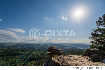 Majestic rocky cliffs and towering pine trees against blue sky. Majestic rocky cliffs and towering pine trees against blue sky. 140463994
