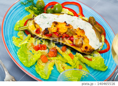 Stuffed tasty eggplant baked with vegetables and cheese Stuffed tasty eggplant baked with vegetables and cheese 140465516