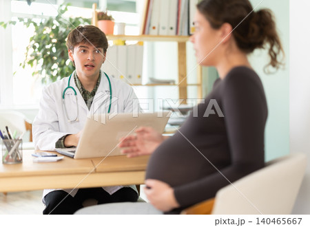 Woman in the third trimester listens to the doctors recommendations Woman in the third trimester listens to the doctors recommendations 140465667