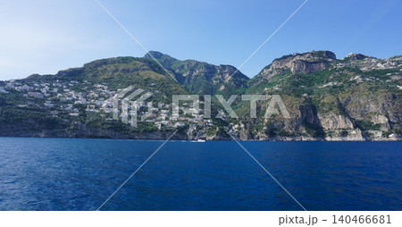 The charming Italian seaside town of Praiano, perched above steep rocky cliffs with magnificent views of the Amalfi coast. The charming Italian seaside town of Praiano, perched above steep rocky cliffs with magnificent views of the Amalfi coast. 140466681