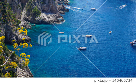 Beautiful coastline - Faraglioni rocks at Capri In Naples, Italy. Beach landscape. Beautiful coastline - Faraglioni rocks at Capri In Naples, Italy. Beach landscape. 140466734