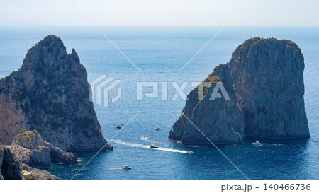 Beautiful coastline - Faraglioni rocks at Capri In Naples, Italy. Beach landscape. Beautiful coastline - Faraglioni rocks at Capri In Naples, Italy. Beach landscape. 140466736