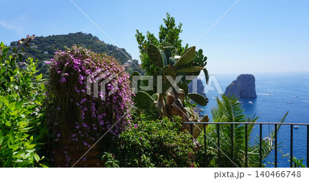 Beautiful coastline - Faraglioni rocks at Capri In Naples, Italy. Beach landscape. Beautiful coastline - Faraglioni rocks at Capri In Naples, Italy. Beach landscape. 140466748