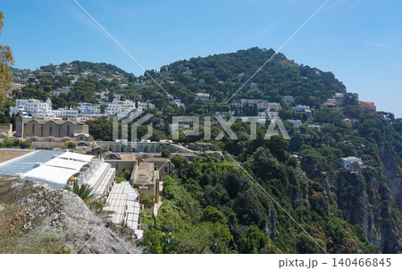 Coastal slopes of the island Capri with luxurious villas located on them. Coastal slopes of the island Capri with luxurious villas located on them. 140466845