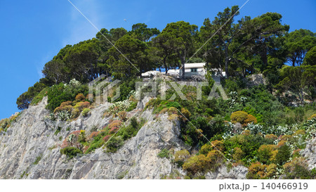 Coastal slopes of the island Capri with luxurious villas located on them. Coastal slopes of the island Capri with luxurious villas located on them. 140466919