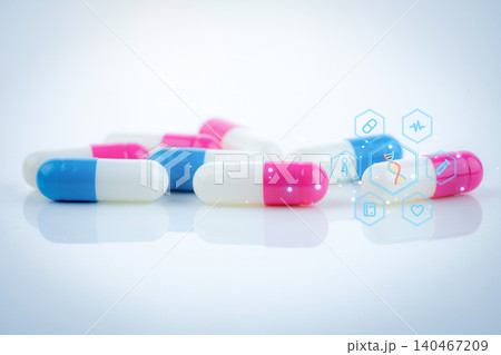 Pink-white and blue-white capsule pills with concept of precision medicine with nanotechnology, proteomics, and advanced artificial intelligence to enhance diagnostics and patient-specific solutions. Pink-white and blue-white capsule pills with concept of precision medicine with nanotechnology, proteomics, and advanced artificial intelligence to enhance diagnostics and patient-specific solutions. 140467209