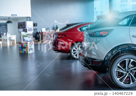 Car parked in luxury showroom. Car dealership office. Car showroom business. New car parked in modern showroom. Auto for sale and rent business. Automobile leasing and insurance. Electric automobile. Car parked in luxury showroom. Car dealership office. Car showroom business. New car parked in modern showroom. Auto for sale and rent business. Automobile leasing and insurance. Electric automobile. 140467229
