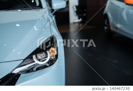 Car parked in luxury showroom. Car dealership office. Car showroom business. New car parked in modern showroom. Auto for sale and rent business. Automobile leasing and insurance. Electric automobile. Car parked in luxury showroom. Car dealership office. Car showroom business. New car parked in modern showroom. Auto for sale and rent business. Automobile leasing and insurance. Electric automobile. 140467230
