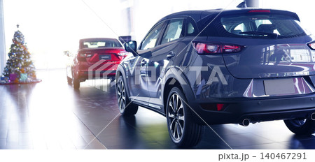 Rearview of car parked in luxury showroom. Car dealership office. New car parked in modern showroom. Car for sale business concept. Automobile leasing and insurance agent concept. Electric vevicle. Rearview of car parked in luxury showroom. Car dealership office. New car parked in modern showroom. Car for sale business concept. Automobile leasing and insurance agent concept. Electric vevicle. 140467291