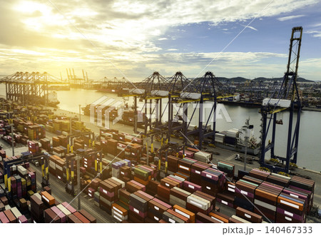 Logistics and transportation of container cargo ship at ship port. Container truck and crane bridge in shipyard. Import export and transport industry. Terminal port for export transport by ship. Logistics and transportation of container cargo ship at ship port. Container truck and crane bridge in shipyard. Import export and transport industry. Terminal port for export transport by ship. 140467333