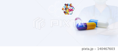 Antibiotic capsule pills and prescription drugs banner with doctor and stethoscope background. Healthcare and medicine. Medical care in hospital. Antibiotic drug selection. Antibiotic drug resistance. Antibiotic capsule pills and prescription drugs banner with doctor and stethoscope background. Healthcare and medicine. Medical care in hospital. Antibiotic drug selection. Antibiotic drug resistance. 140467603
