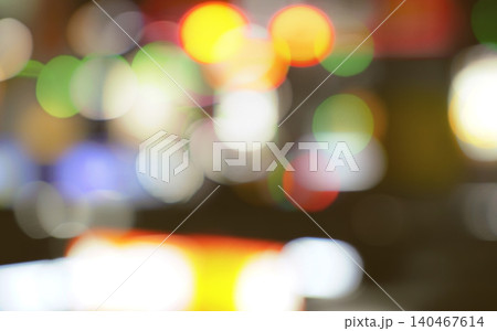 Blurred bokeh background. Abstract and blurry lights create a festive atmosphere with bright, colorful bokeh background. Vibrant Christmas celebration. Holiday wallpaper for a festive holiday season. Blurred bokeh background. Abstract and blurry lights create a festive atmosphere with bright, colorful bokeh background. Vibrant Christmas celebration. Holiday wallpaper for a festive holiday season. 140467614