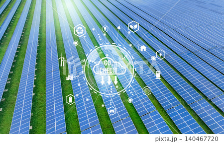 Carbon credit concept featuring a solar farm in background. Green energy solutions through sustainable renewable energy sources, including wind and solar farms for carbon credits in industrial sector. Carbon credit concept featuring a solar farm in background. Green energy solutions through sustainable renewable energy sources, including wind and solar farms for carbon credits in industrial sector. 140467720