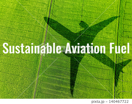 Sustainable aviation fuel concept. Airplane flying above green field. Biofuel in aviation. Sustainable transportation and eco-friendly flight with biofuel use. Aviation sustainability. Air travel. Sustainable aviation fuel concept. Airplane flying above green field. Biofuel in aviation. Sustainable transportation and eco-friendly flight with biofuel use. Aviation sustainability. Air travel. 140467722