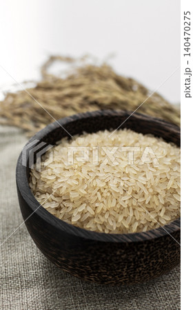 asian parboiled rice grains in rustic setting display in Cambodia 140470275