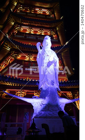 Guanyin Statue Illuminated at Night in a Temple 140470682