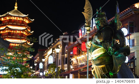 Chinese architecture at night with statue and pagoda Chinese architecture at night with statue and pagoda 140470695