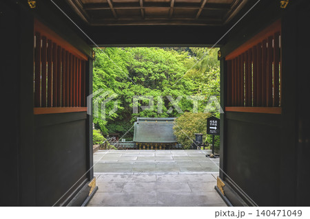 April 29 2026 Zuihoden gate framing lush forest landscape 140471049