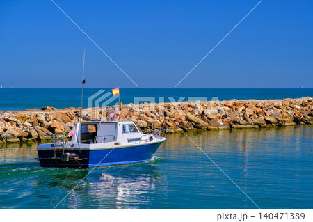 Motor boat going out to sea Motor boat going out to sea 140471389