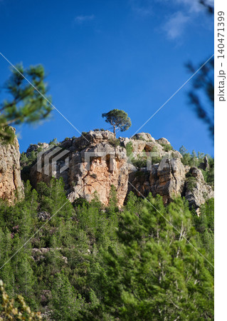 a rock against the blue sky a rock against the blue sky 140471399