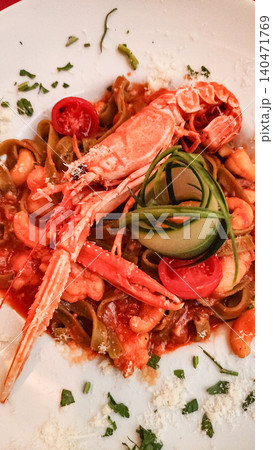 Delicious seafood pasta dish with langoustine and vegetables enjoyed during summer vacation in croatia Delicious seafood pasta dish with langoustine and vegetables enjoyed during summer vacation in croatia 140471769